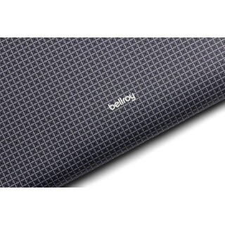 Bellroy Lite Laptop Sleeve 14" in dark textured fabric with subtle geometric pattern and logo detail
