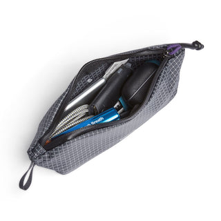 Bellroy Lite Pouch Duo opened showing organized travel essentials inside durable recycled fabric pouch