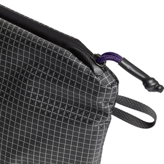 Bellroy Lite Pouch Duo showing close-up of textured black recycled nylon fabric with zipper pull detail