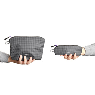 Bellroy Lite Pouch Duo in recycled nylon fabric held showing textured gray surface and compact design