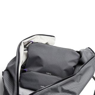 Bellroy Lite Pouch Duo showing two textured gray pouches inside an open gray travel bag