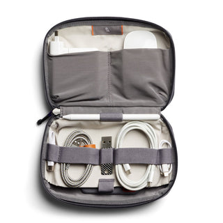 Bellroy Tech Kit open showing organized cables and chargers inside recycled fabric case