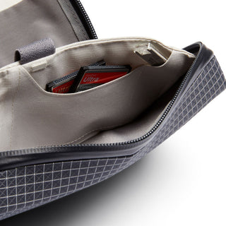 Bellroy Tech Kit showing internal fabric pockets with electronics storage and mesh textured exterior