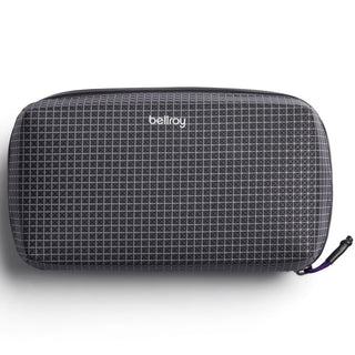 Bellroy Tech Kit in black grid pattern fabric with compact rectangular shape and zipper closure