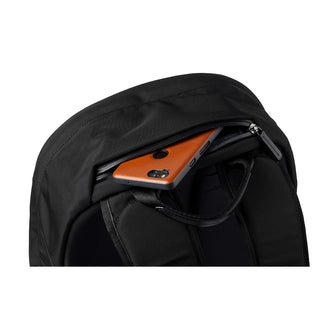 Bellroy Classic Backpack Second Edition black with hidden zippered pocket storing an orange phone