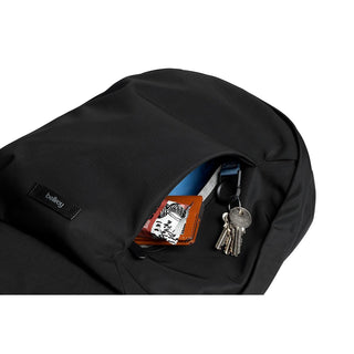 Bellroy Classic Backpack Second Edition in black showing open front pocket with keys and wallet inside