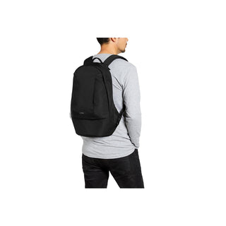 Bellroy Classic Backpack Second Edition in black recycled fabric worn on back by person in gray long sleeve shirt