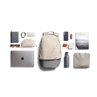 Bellroy Classic Backpack Second Edition in beige with organized everyday essentials laid out flat