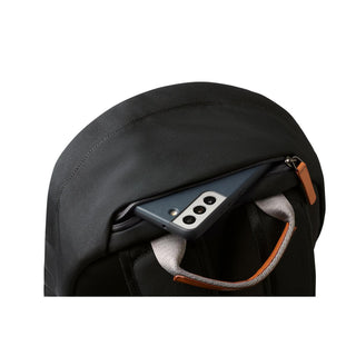 Bellroy Classic Backpack Second Edition in black with zippered top pocket holding smartphone visible