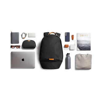 Bellroy Classic Backpack Second Edition in black with leather accents shown with everyday essentials neatly arranged