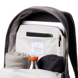 Bellroy Classic Backpack Premium open showing organized interior with accessories and laptop sleeve