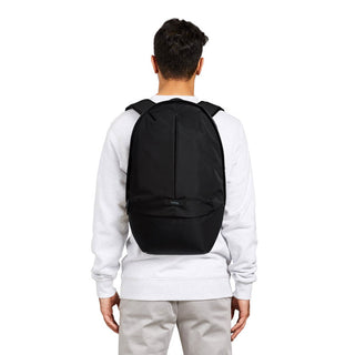 Bellroy Classic Backpack Plus Second Edition in black worn on back showing slim, sleek design