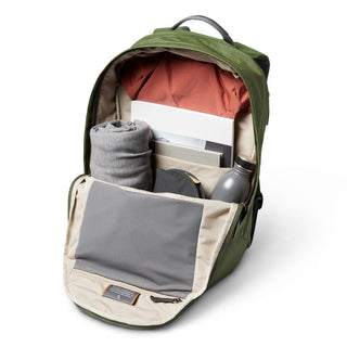 Bellroy Classic Backpack Plus Second Edition opened showing organized packed interior with green exterior