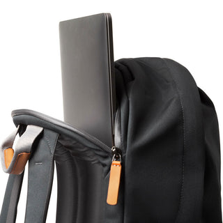 Bellroy Classic Backpack Plus Second Edition in black with padded straps and leather zipper pull carrying a laptop