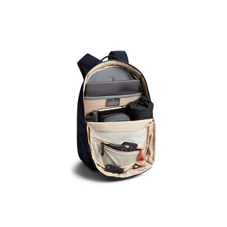 Bellroy Via Backpack open with organized compartments and tech gear inside, showing interior layout and storage features
