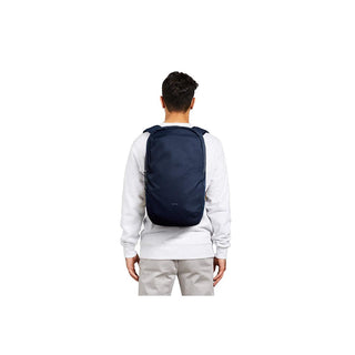 Bellroy Via Backpack worn by person, navy blue recycled fabric with sleek minimalist design