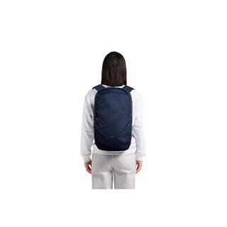 Bellroy Via Backpack in navy blue worn by model showing slim back profile and minimalist design