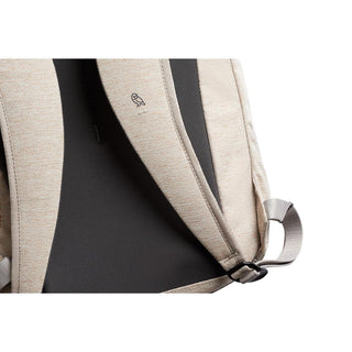 Bellroy Via Backpack in beige recycled fabric showing padded back panel and adjustable strap buckle