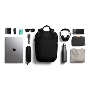 Bellroy Via Workpack in black alongside tech accessories and personal items neatly arranged on white background