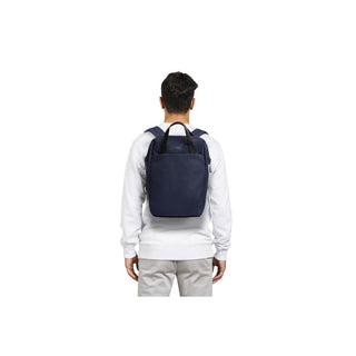 Bellroy Via Workpack navy backpack worn by person showing back view with adjustable straps