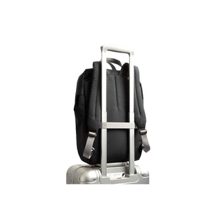 Bellroy Via Workpack black backpack secured on silver suitcase handle for travel convenience
