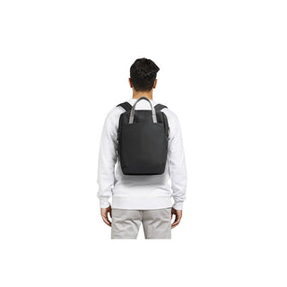 Bellroy Via Workpack worn in black recycled fabric on a person’s back showing slim, modern design