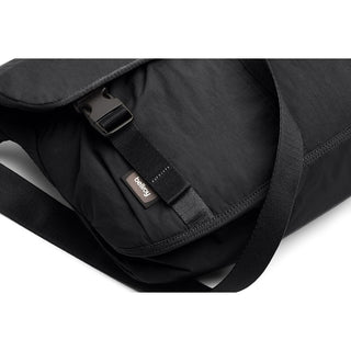 Bellroy Cinch Messenger Bag in black with adjustable strap and durable recycled nylon fabric close-up