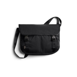 Bellroy Cinch Messenger Bag in black with adjustable strap and secure buckle closure made from recycled nylon