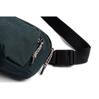 Bellroy Venture Hip Pack 1.5L in dark green recycled fabric with dual zipper and adjustable black strap