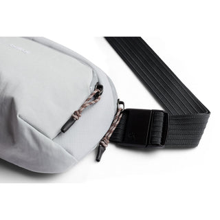 Bellroy Venture Hip Pack 1.5L in light grey with textured fabric and adjustable black strap buckle close-up