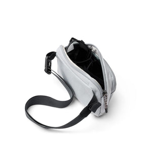 Bellroy Venture Hip Pack 1.5L in light gray with open main compartment and black adjustable strap