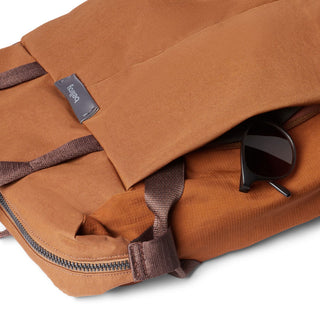 Bellroy Tokyo Totepack Compact in brown recycled fabric with zipper and sunglasses in pocket close-up view