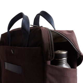 Bellroy Tokyo Work Bag brown fabric with navy handles and side pocket holding a water bottle