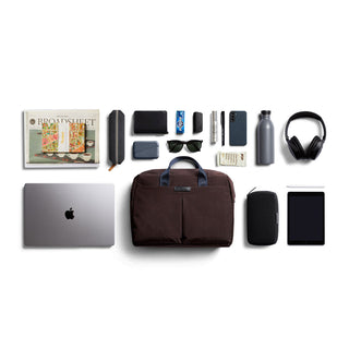 Bellroy Tokyo Work Bag in dark brown fabric with organized everyday tech and accessories laid out neatly