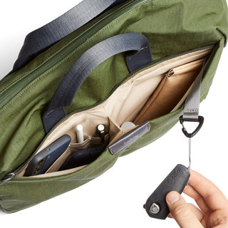 Bellroy Tokyo Work Bag in green recycled fabric showing organized interior pockets and key clip holder