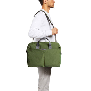 Bellroy Tokyo Work Bag in green recycled fabric carried with adjustable shoulder strap and top handles