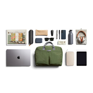 Bellroy Tokyo Work Bag in olive green with front pockets and recycled fabric texture displayed with accessories
