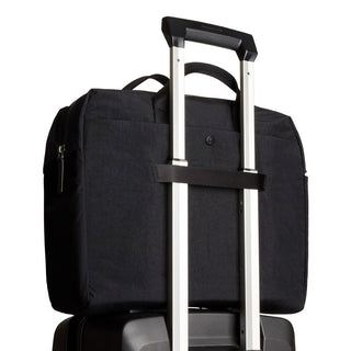 Bellroy Tokyo Work Bag in black recycled polyester shown attached to suitcase handle from rear angle