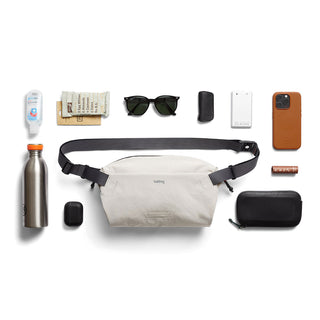 Bellroy Lite Sling bag in light beige with adjustable black strap and water-resistant eco fabric