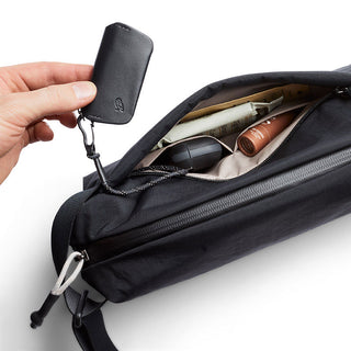 Bellroy Lite Sling in black water-resistant fabric with organized interior and key holder detail