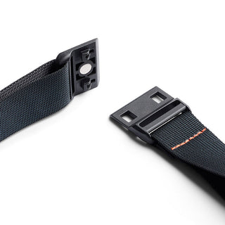 Bellroy Lite Sling black adjustable strap with magnetic buckle and orange stitch detail close-up