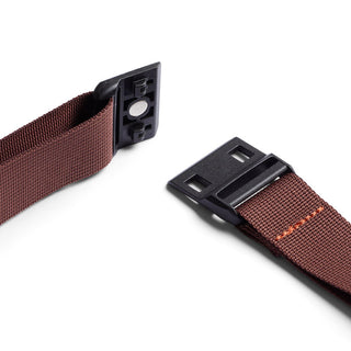 Bellroy Lite Sling brown adjustable strap with black plastic quick-release buckle close-up view