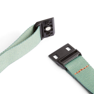 Bellroy Lite Sling detachable light green woven strap with black plastic buckle hardware close-up