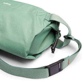 Bellroy Lite Sling in green with durable water-resistant recycled fabric and adjustable strap buckle close-up