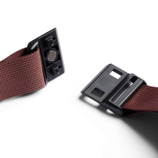 Bellroy Lite Sling Mini brown strap with black magnetic buckle closure detail close-up