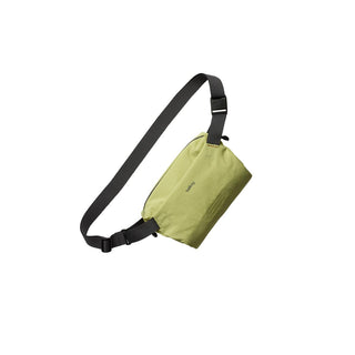 Bellroy Lite Sling Mini in olive green with adjustable black strap and minimalist recycled fabric design