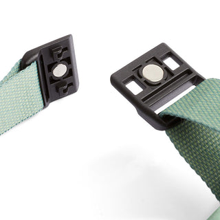 Bellroy Lite Sling Mini green woven strap with black magnetic buckle closure detail close-up