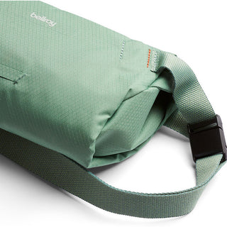 Bellroy Lite Sling Mini in sage green with water-resistant fabric and adjustable strap detail