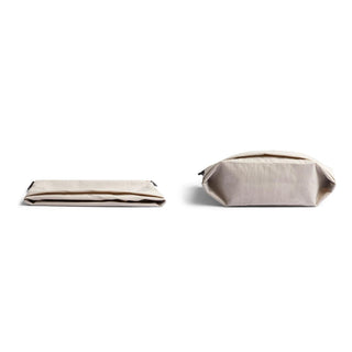 Bellroy Lite Sacoche in natural fabric shown flat and standing, highlighting its minimalist design and texture