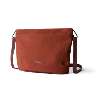 Bellroy Lite Sacoche in rust recycled fabric with adjustable crossbody strap and minimalist design